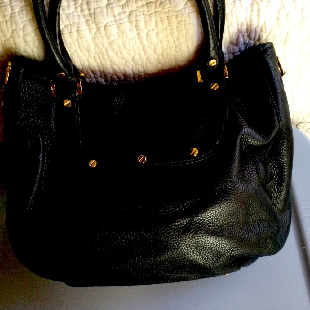 Black leather Tory Burch handbag.